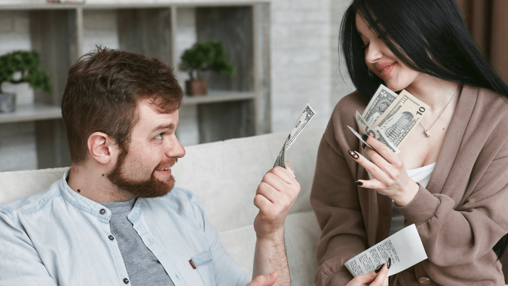 a person handing money to another person