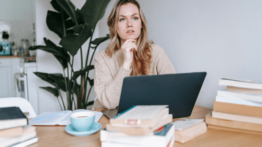 a person sitting in front of a laptop computer