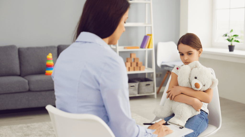 a person sitting on a couch talking to another person